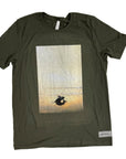 Green t-shirt with a graphic of a baby turtle