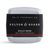 Solid fragrance container with 'Fulton & Roark' label on a white background