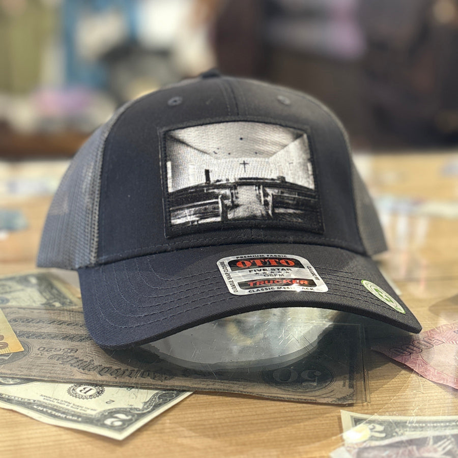 Black cap with a black and white  church patch