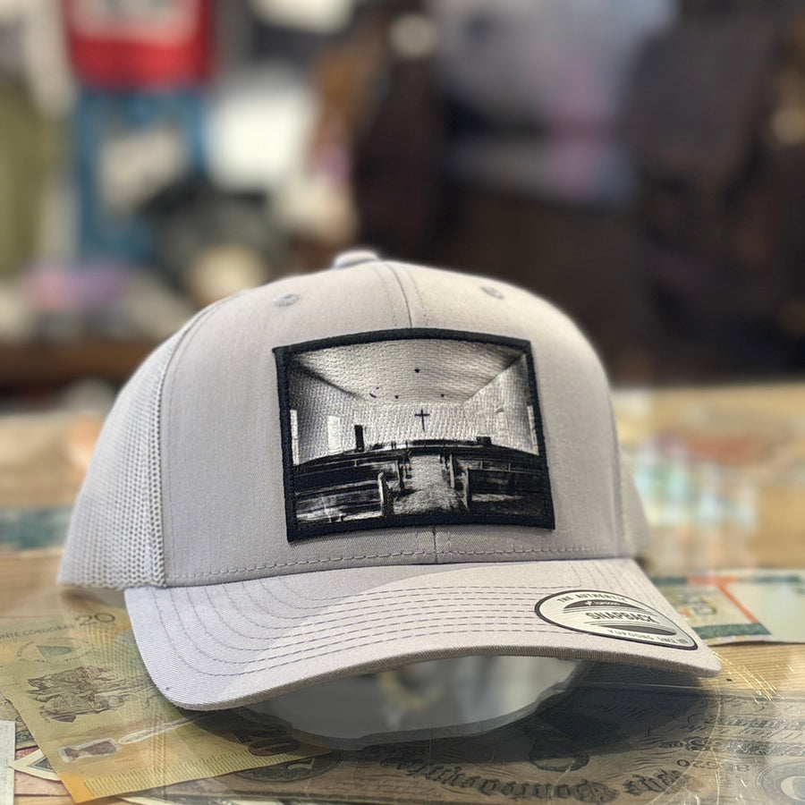 Gray cap with a black and white church patch