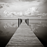 Calm coastal water reflecting soft sky near 30A dunes.